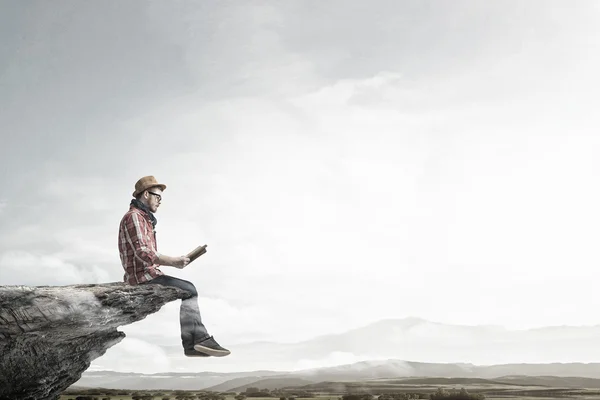 Hipster guy with book . Mixed media — Stock Photo, Image