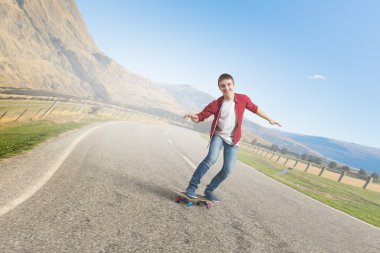 Çocuk kaykay binmek. Karışık teknik