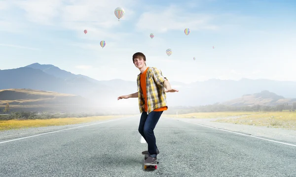 Boy ride skateboard . Mixed media — Stock Photo, Image