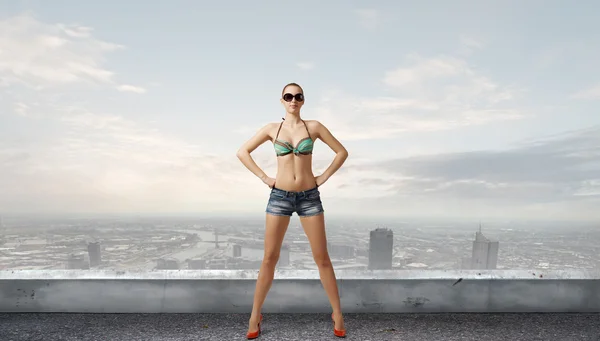 Hitch hiker woman on roof . Mixed media — Stock Photo, Image