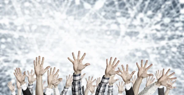 Grupo de personas con las manos levantadas. Medios mixtos — Foto de Stock