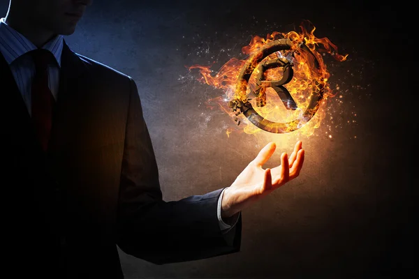 Copyright symbol burning in fire . Mixed media — Stock Photo, Image