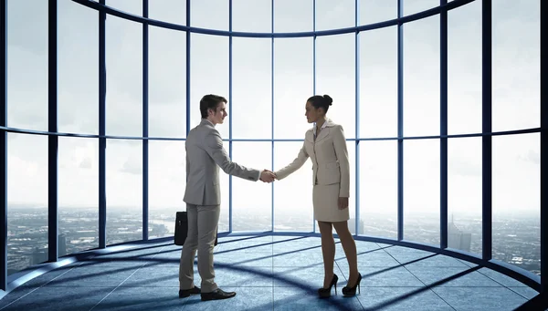 Business partners handshake . Mixed media — Stock Photo, Image