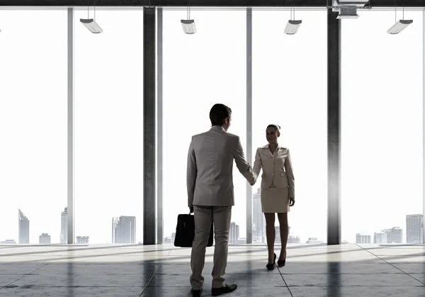 Business partners handshake . Mixed media — Stock Photo, Image