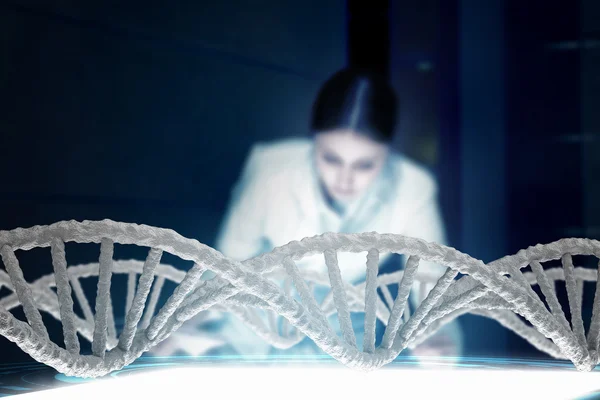 Scientist woman working in laboratory . Mixed media — Stock Photo, Image