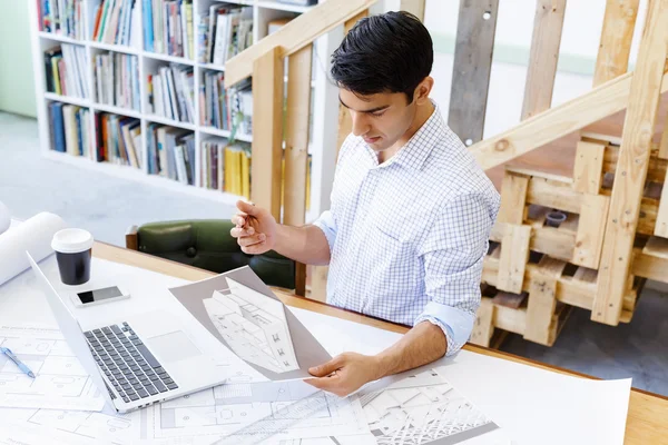 Young man architect in office — Stock Photo, Image