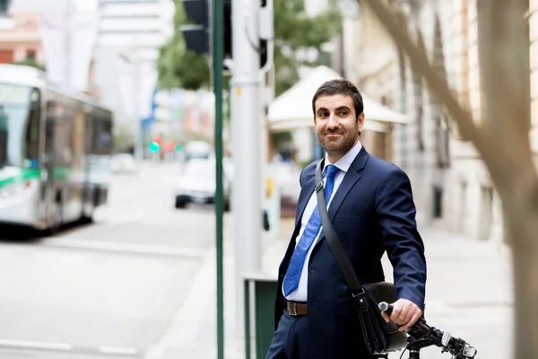 Young businessmen with a bike Stock Image