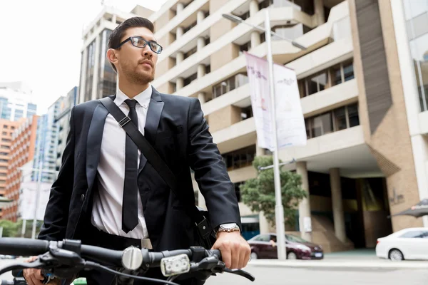 Young businessmen with a bike