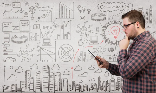 Hipster guy with tablet device . Mixed media — Stock Photo, Image