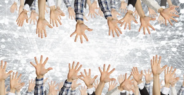 Grupo de personas con las manos levantadas. Medios mixtos — Foto de Stock