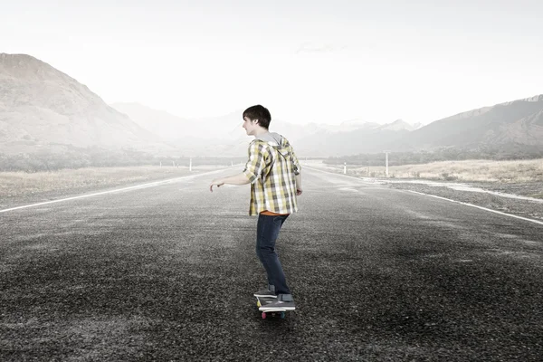 Boy ride skateboard . Mixed media — Stock Photo, Image