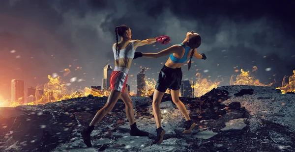 Girls boxing outdoor . Mixed media — Stock Photo, Image