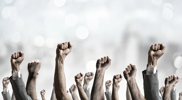 Group of people with raised hands . Mixed media — Stock Photo, Image