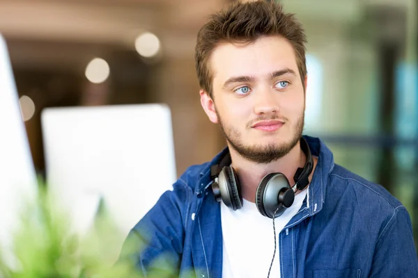 Young man working in office — Stock Photo, Image