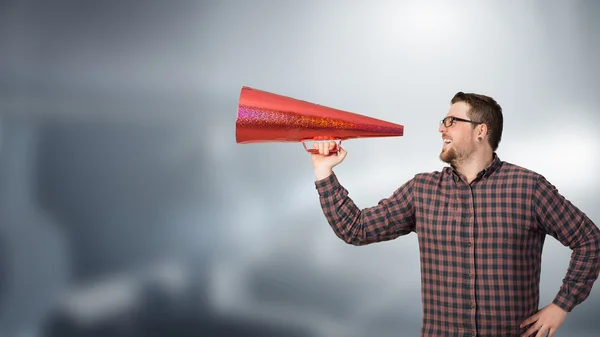 Hipster man shout in trumpet — Stock Photo, Image