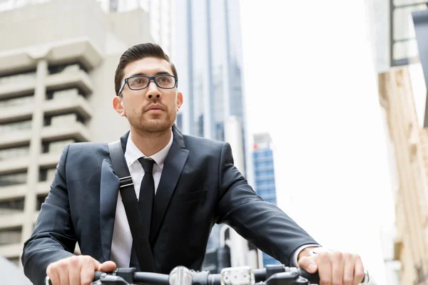 Young businessmen with a bike