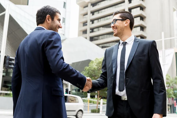 Two businessmen shaking their hands — Stock Photo, Image