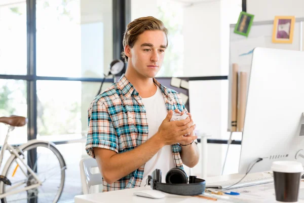 Young man working in office — Stock Photo, Image