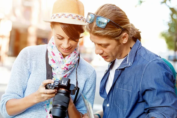Smiling couple with the camera Stock Image
