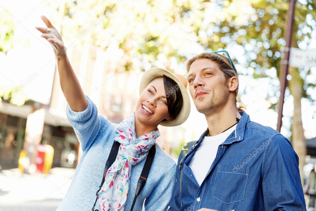 Girl and guy on the streets of a city