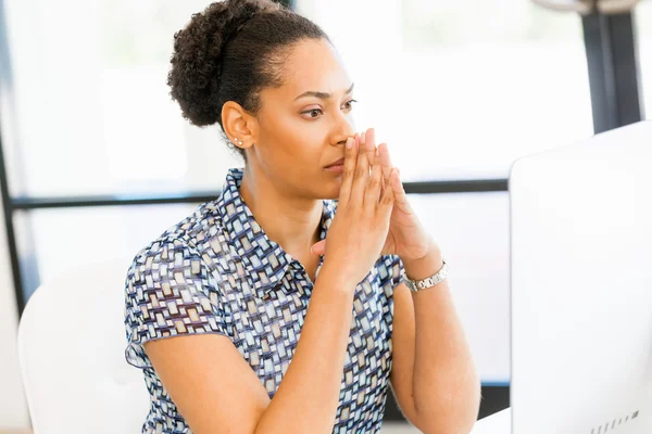 Portrait of tired afro-american office worker sitting in offfice Stock Picture