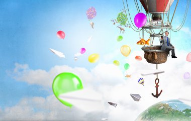 Aerostat içinde seyahat adam. Karışık teknik