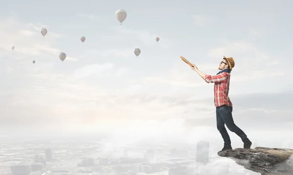 Hipster guy with book . Mixed media — Stock Photo, Image