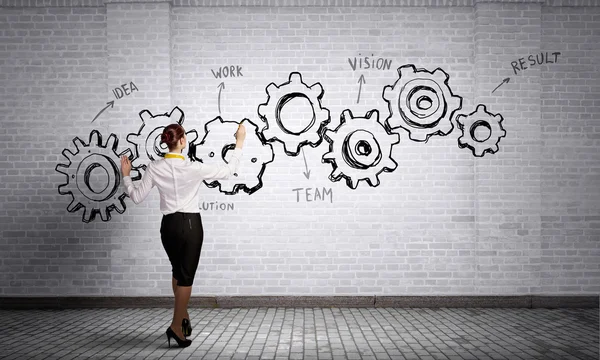 Mujer presentando concepto de trabajo en equipo. Medios mixtos — Foto de Stock