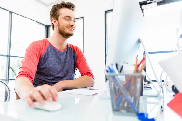 Young man working in office — Stock Photo, Image