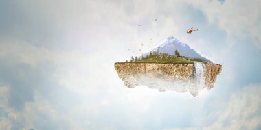 Havada yüzen karlı bir dağ.