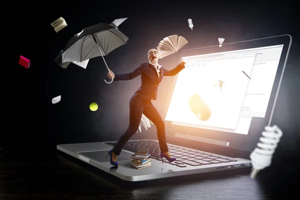 Young businesswoman walking with umbrella — Stock Photo, Image