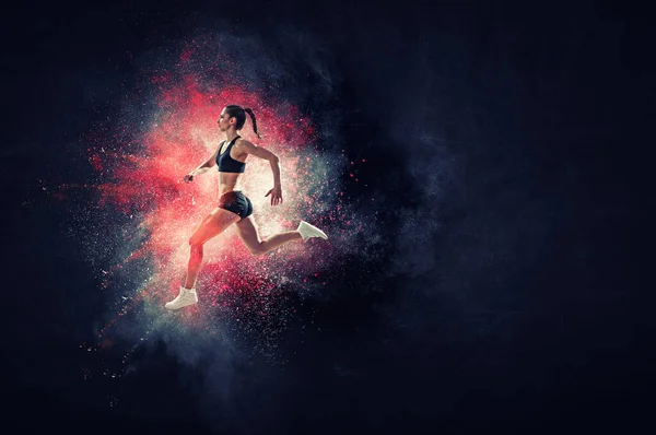 Atlético mulher corredor no colorido fundo — Fotografia de Stock