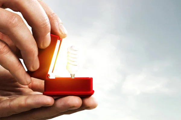 Light bulb inside gift box — Stock Photo, Image