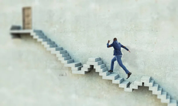 Black businessman climbing stone stairs illustrating career development and success concept. Mixed media — Stock Photo, Image