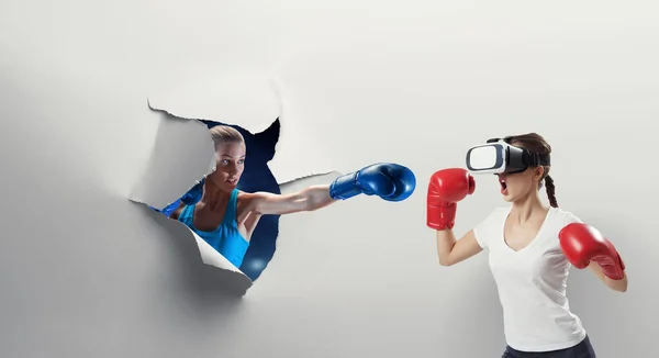 Young woman boxing in VR glasses . Mixed media — Stock Photo, Image