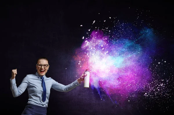 Businesswoman spraying paint . Mixed media — Stock Photo, Image