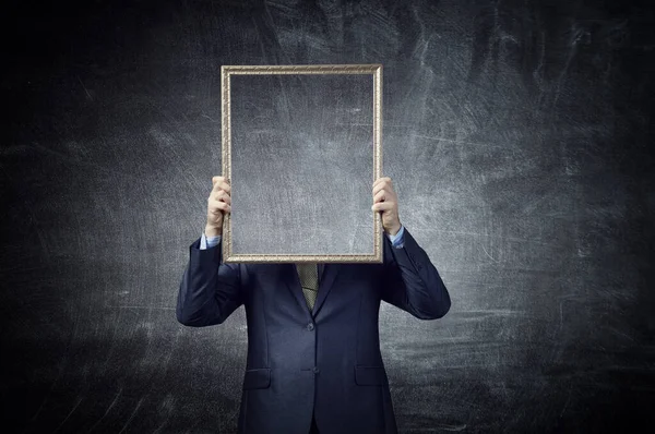 Man holding blank poster . Mixed media — Stock Photo, Image