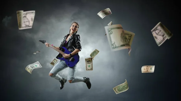 Young and beautiful rock girl playing the electric guitar — Stock Photo, Image