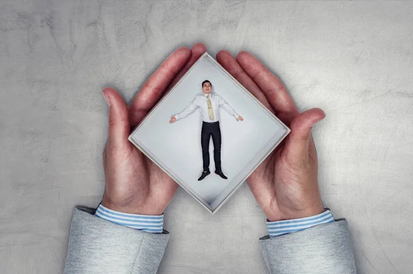 Businessman inside a box . Mixed media — Stock Photo, Image