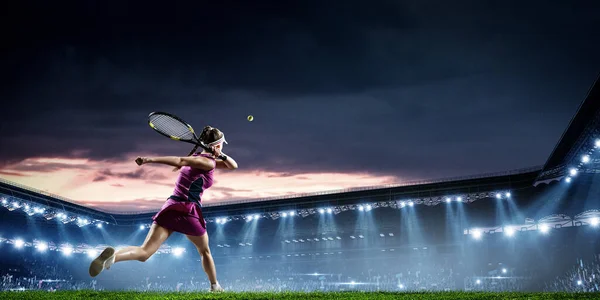 Young woman playing tennis in action. Mixed media — Stock Photo, Image