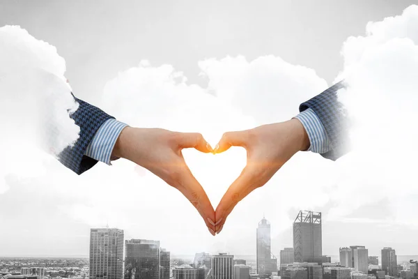 Male hands form heart shape — Stock Photo, Image