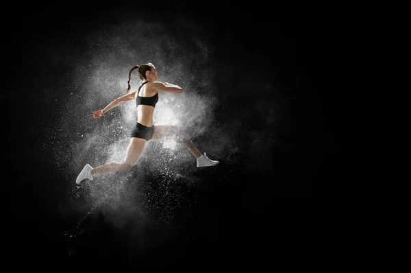 Corredor de mujer atlética sobre fondo colorido —  Fotos de Stock