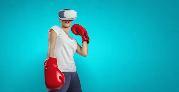 Young woman boxing in VR glasses . Mixed media — Stock Photo, Image