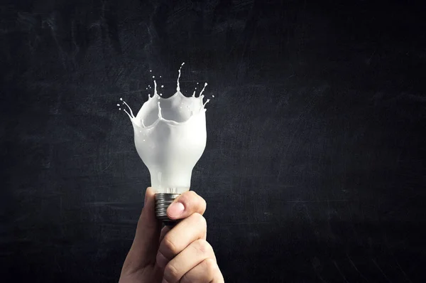 Ampoule avec éclaboussure en verre blanc — Photo