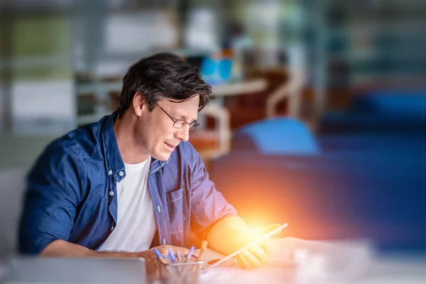 Handsome businessman in office . Mixed media . Mixed media — Stock Photo, Image