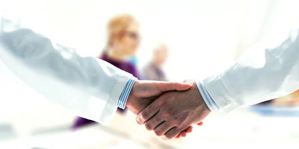 Partnership concept. Image of handshake . Mixed media — Stock Photo, Image