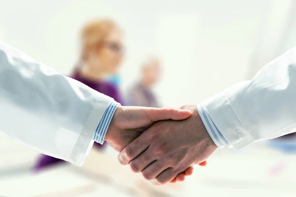 Partnership concept. Image of handshake . Mixed media — Stock Photo, Image