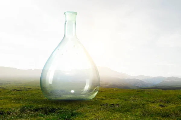 Empty glass bottle . Mixed media — Stock Photo, Image