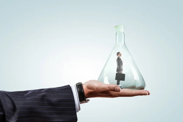 Business man standing inside a glass bottle — Stock Photo, Image