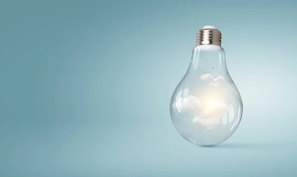 Light bulb on light blue background — Stock Photo, Image